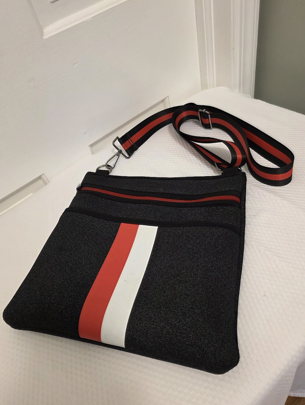 HAUTE SHORE Peyton Medium Charcoal Black Crossbody Bag with Red & White Stripe